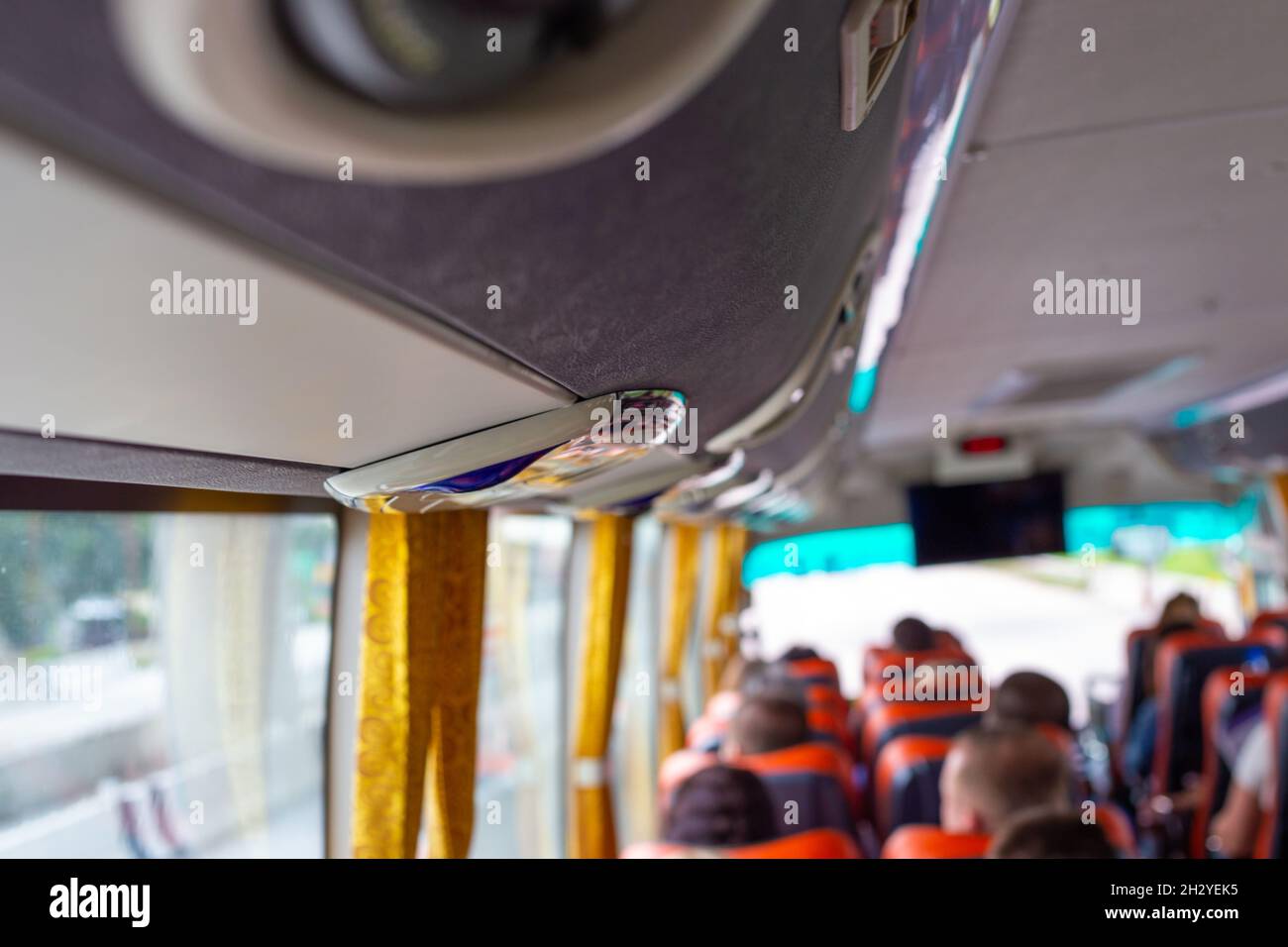 Bus with tourists goes on an excursion, blurred background Stock Photo