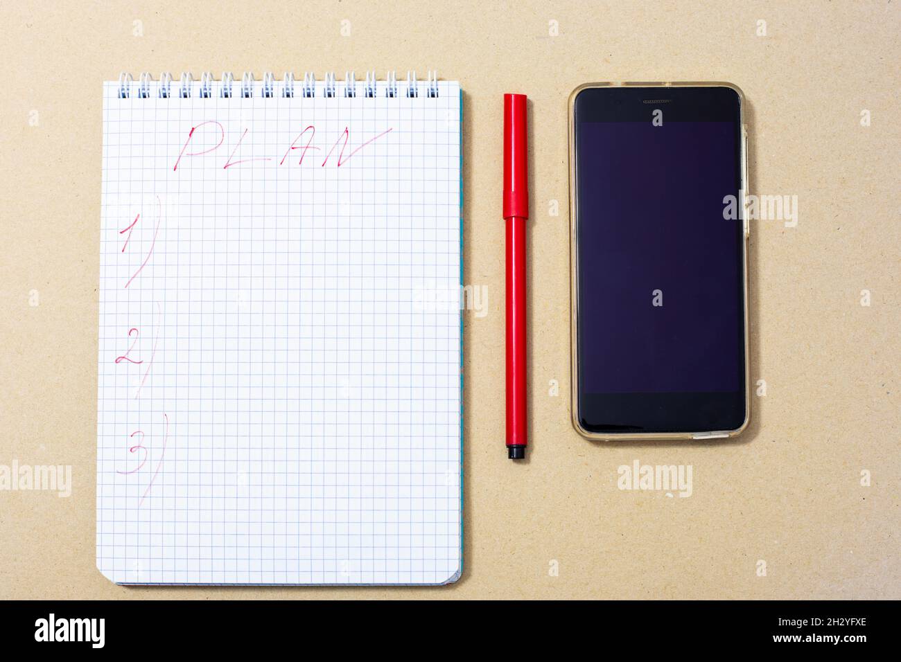 notepad, red marker and phone, top view Stock Photo - Alamy