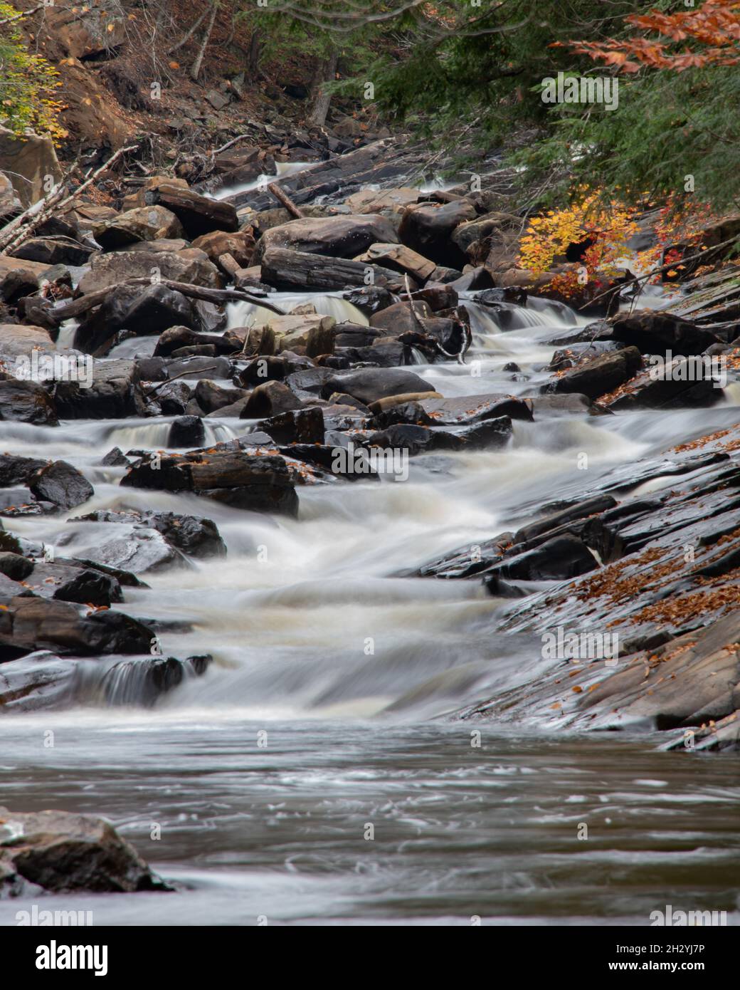 A long exposure image of falls on the Sacandaga River in the Adirondack Mountains, NY USA in autumn Stock Photo