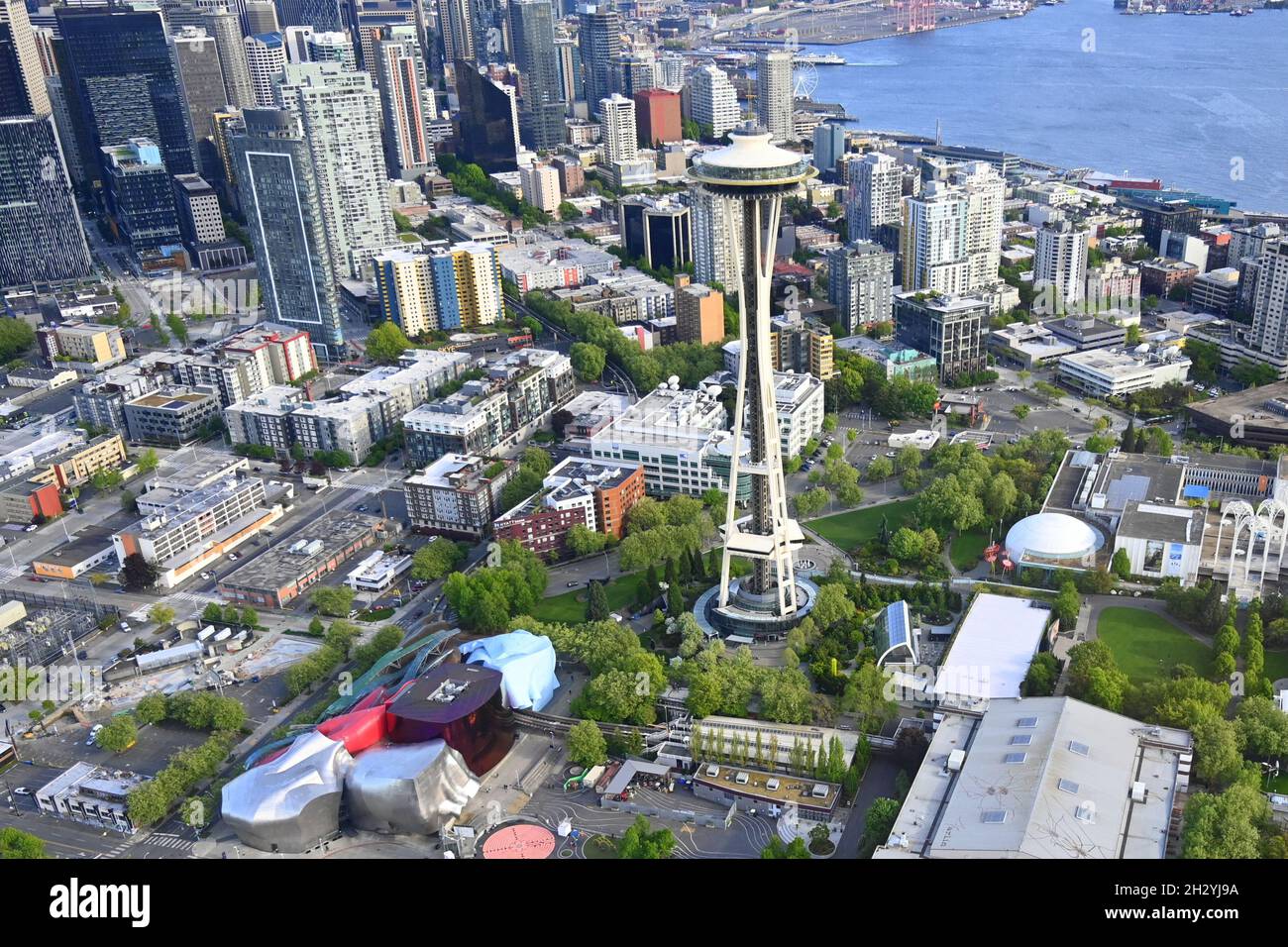 AERIAL VIEWS OF SEATTLE, WASHINGTON, USA...THE CITY SKYLINE, THE SPACE NEEDLE, AND THE COLORFUL MUSEUM OF POP CULTURE AT THE SEATTLE CENTER Stock Photo