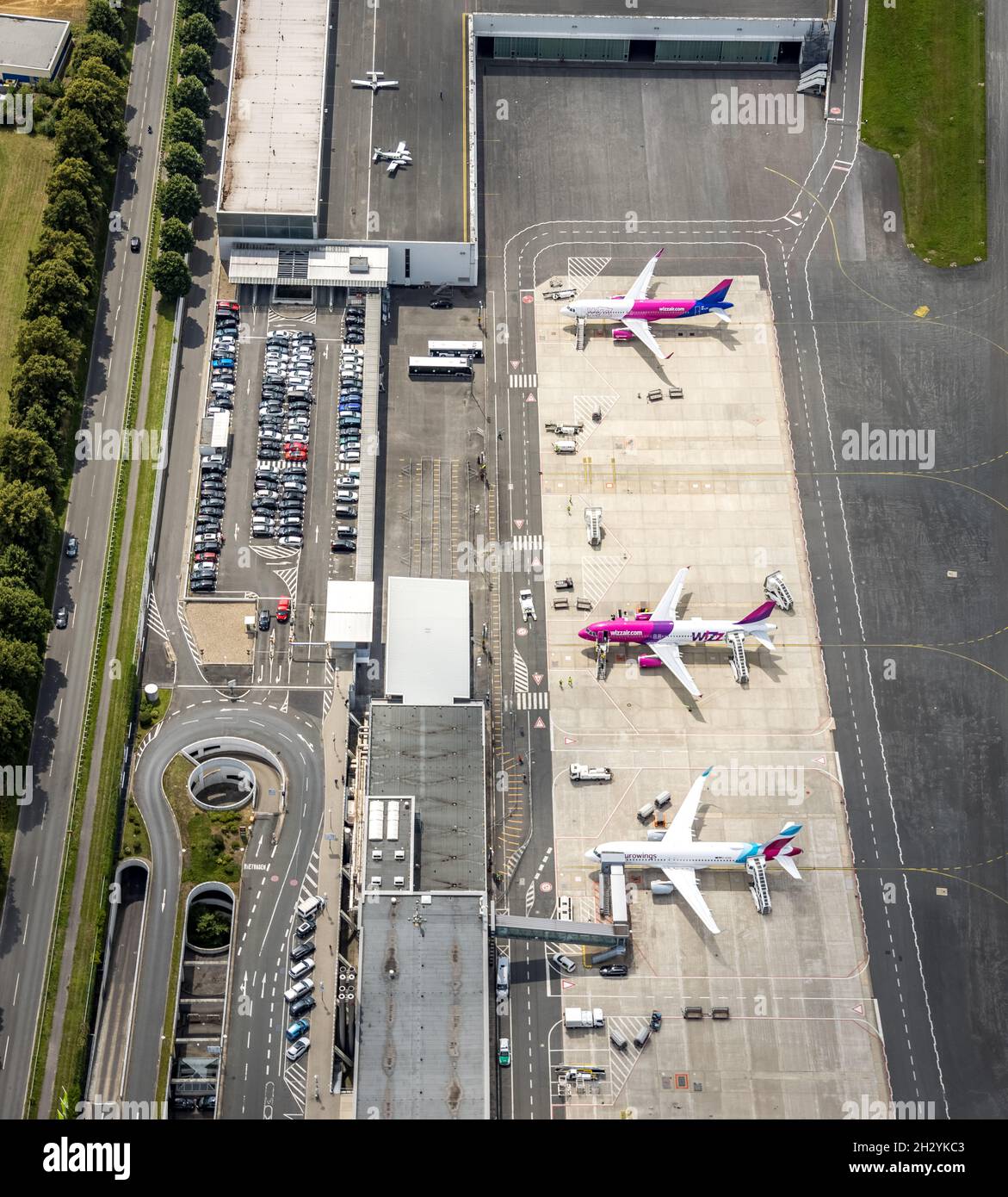 Aerial view, Dortmund Airport, EDLW, Wickede, apron with two jets of Wizzair and one Eurowings plane, Dortmund, Ruhr Area, North Rhine-Westphalia, Ger Stock Photo
