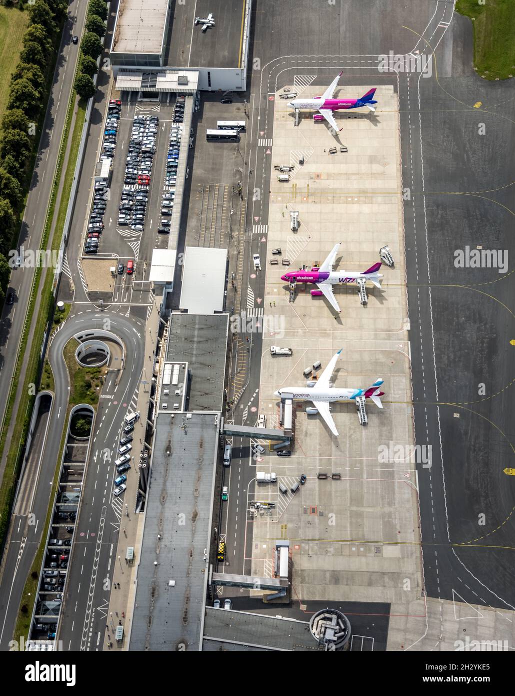 Aerial photo, Dortmund Airport, EDLW, Wickede, apron with two jets of Wizzair and one Eurowings plane, Dortmund, Ruhr Area, North Rhine-Westphalia, Ge Stock Photo