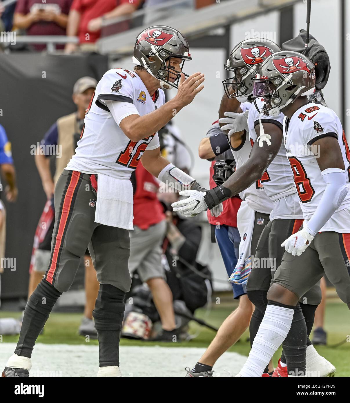 Tampa, United States. 24th Oct, 2021. Tampa Bay Buccaneers quarterback Tom Brady (12) reaches to congratulate Chris Godwin after a touchdown catch against the Chicago Bears during the first half at Raymond James Stadium in Tampa, Florida on Sunday, October 24, 2021. Photo by Steve Nesius/UPI Credit: UPI/Alamy Live News Stock Photo