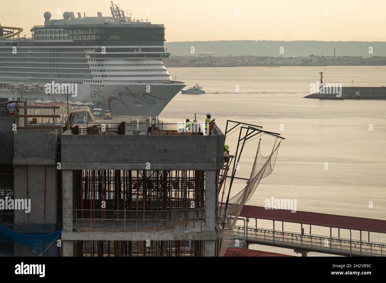 Palma de Mallorca, Balearic Islands, Spain - 09 13 2021: Residential building under construction in Palma port with a cruise ship on the background Stock Photo