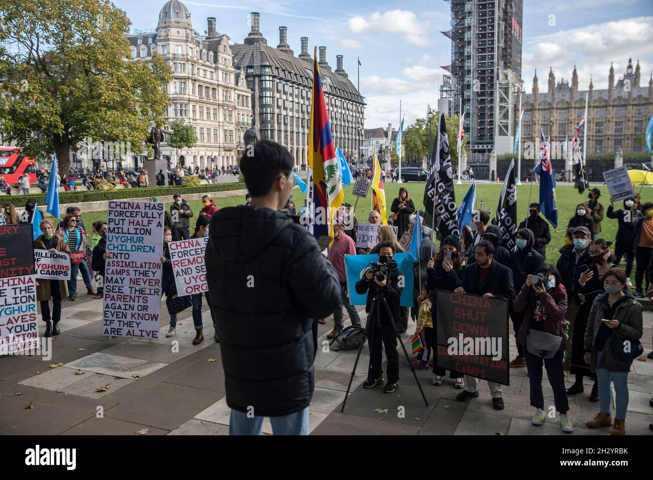 A representative from Hong Kong speaks to protesters during the ...