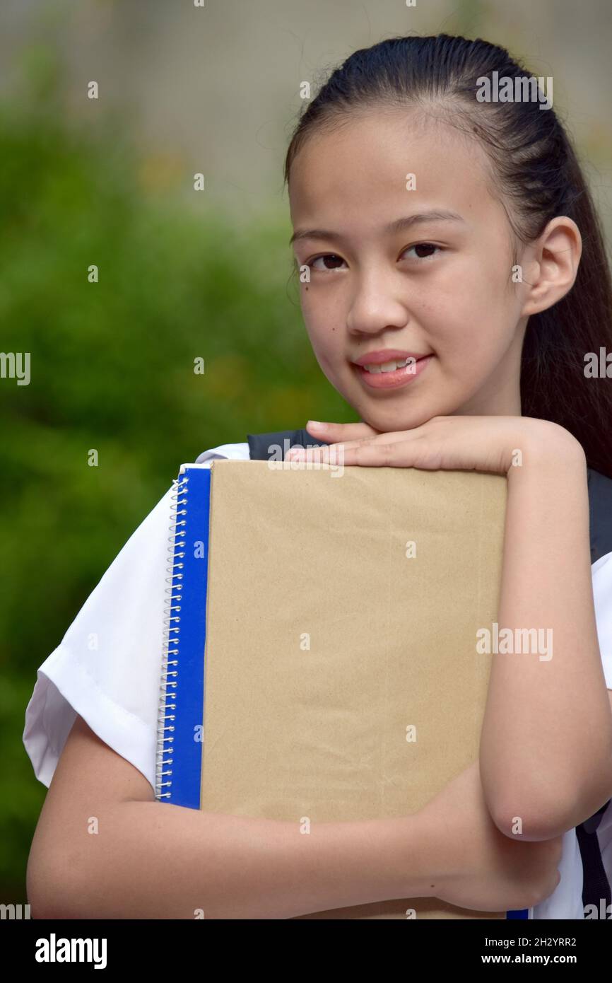Adorable Youthful Minority Girl Student With School Books Stock Photo ...