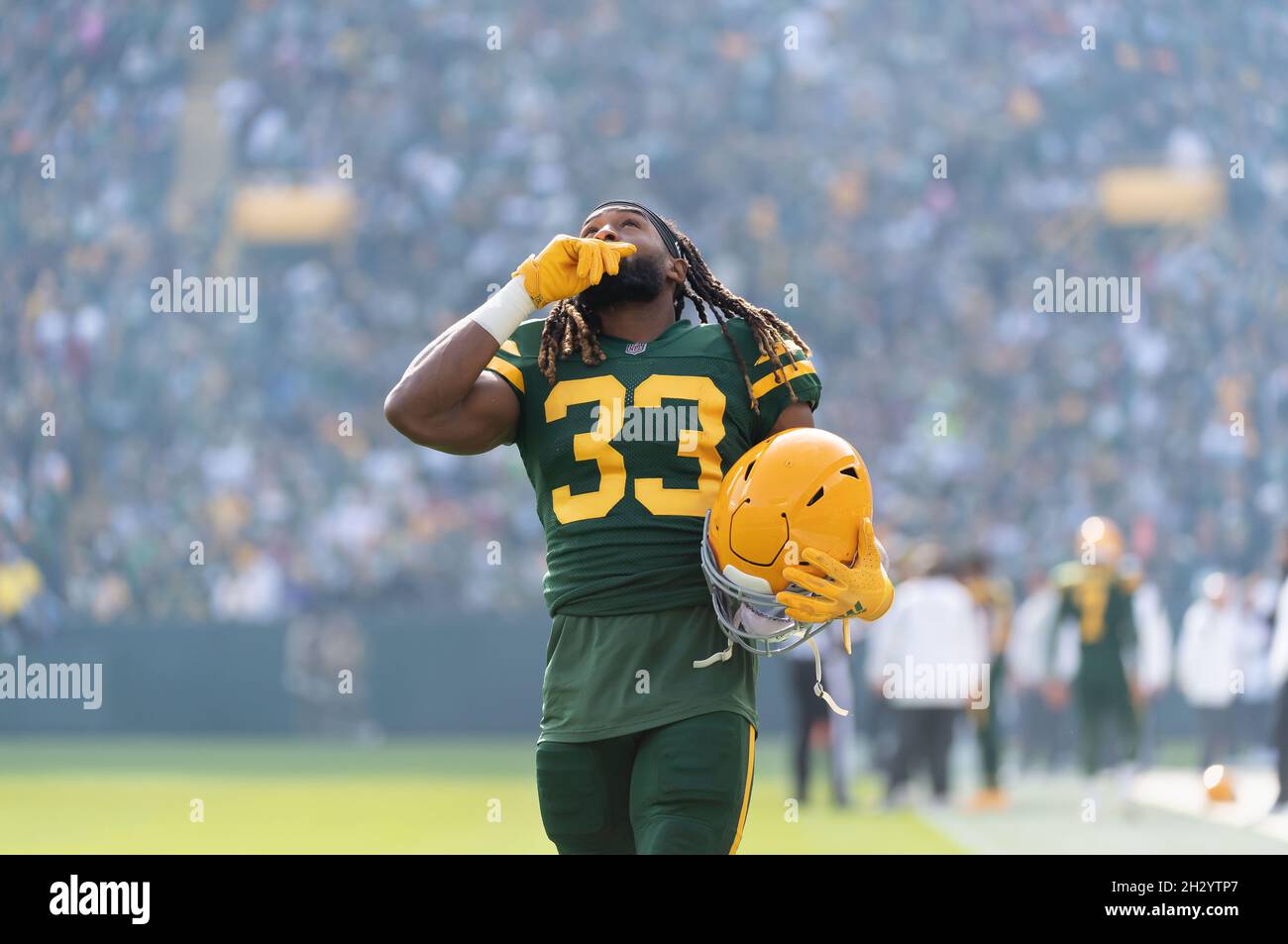 October 24, 2021: Green Bay Packers running back Aaron Jones #33 looks to  the sky before the NFL football game between the Washington Football Team  and the Green Bay Packers at Lambeau