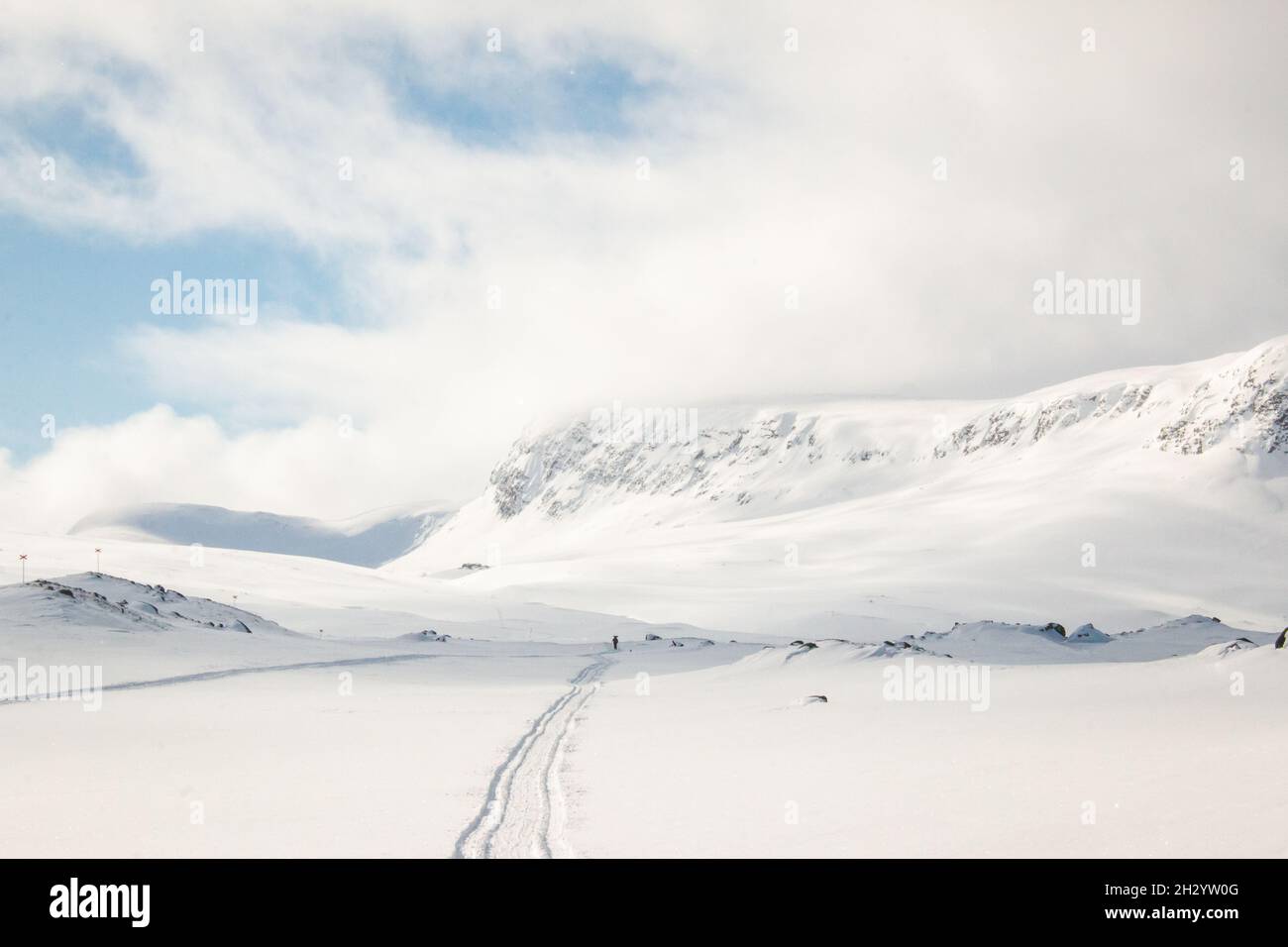 A skiing and snowmobile trail between Alesjaure and Tjaktja huts on Kungsleden trail, April, Swedish Lapland Stock Photo