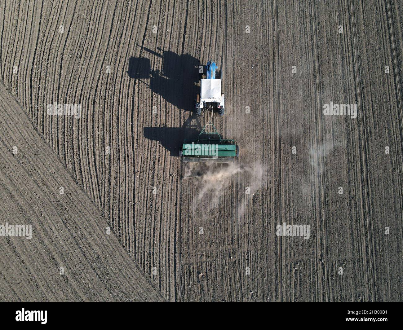 Golbasi, Turkey. 24th Oct, 2021. Aerial photo taken on Oct. 24, 2021 shows a farmer working in a field in Golbasi, Ankara, Turkey. Credit: Mustafa Kaya/Xinhua/Alamy Live News Stock Photo