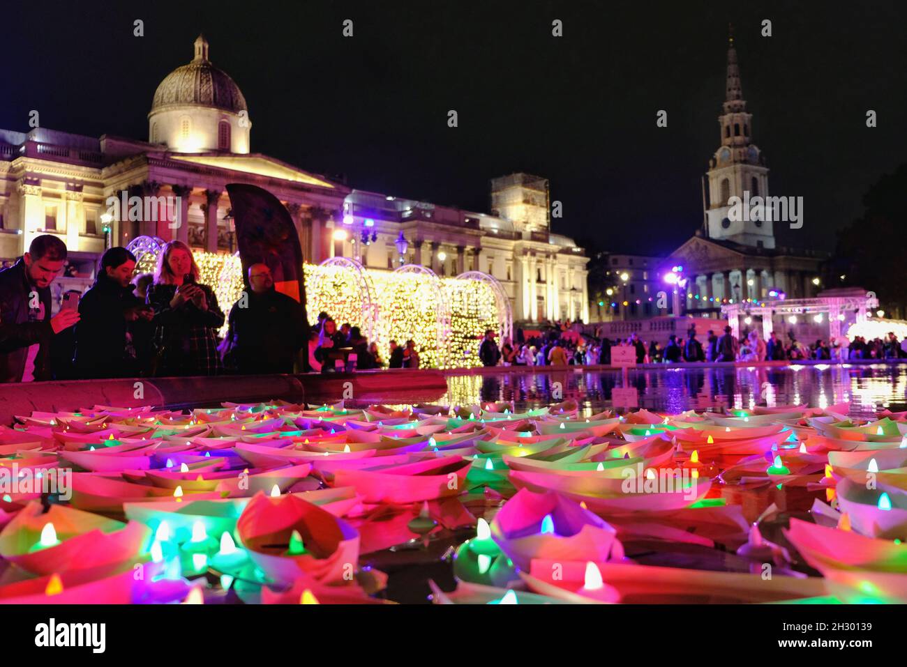 London, UK. Visitors to the Diwali celebrations in Trafalgar Square leave festive messages on