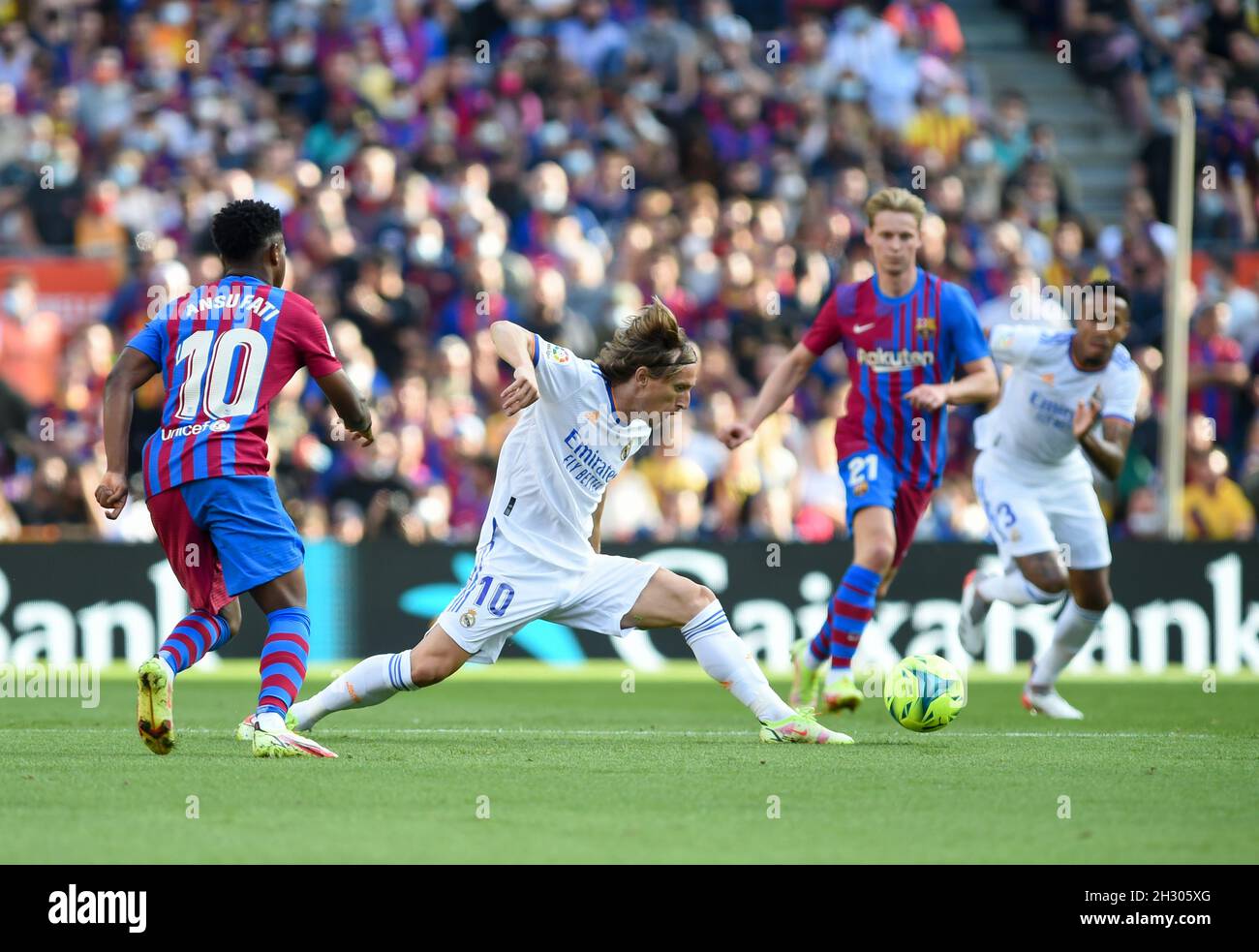 Barcelona, Spain. 24th Oct, 2021. Real Madrid's Luka Modric (C) competes  during a Spanish first division league football match between FC Barcelona  and Real Madrid in Barcelona, Spain, on Oct. 24, 2021.