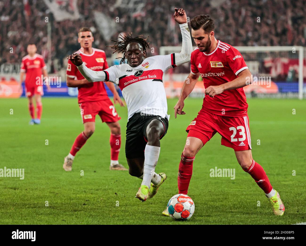 Stuttgart, Germany. 24th Oct, 2021. Tanguy Coulibaly (2nd R) of Stuttgart vies with Niko Giesselmann (1st R) of Union Berlin during a German Bundesliga match between VfB Stuttgart and 1.FC Union Berlin in Stuttgart, Germany, on Oct. 24, 2021. Credit: Philippe Ruiz/Xinhua/Alamy Live News Stock Photo