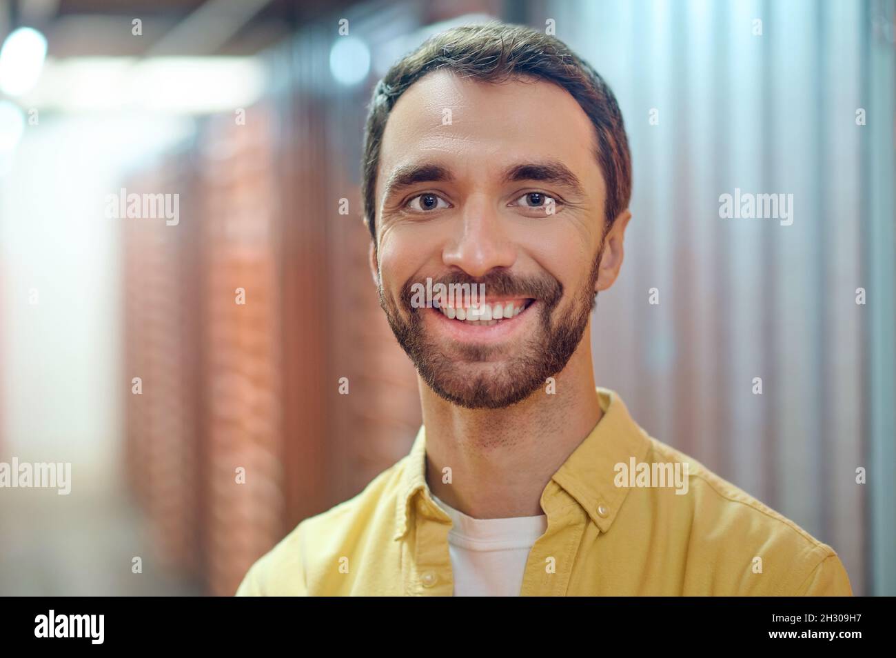 Cheerful smiling man in utility room Stock Photo - Alamy