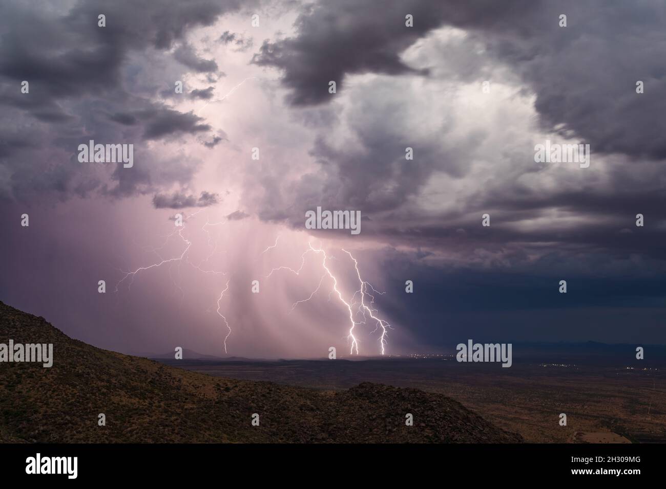 Dramatic storm clouds and lightning bolt strike from a thunderstorm ...