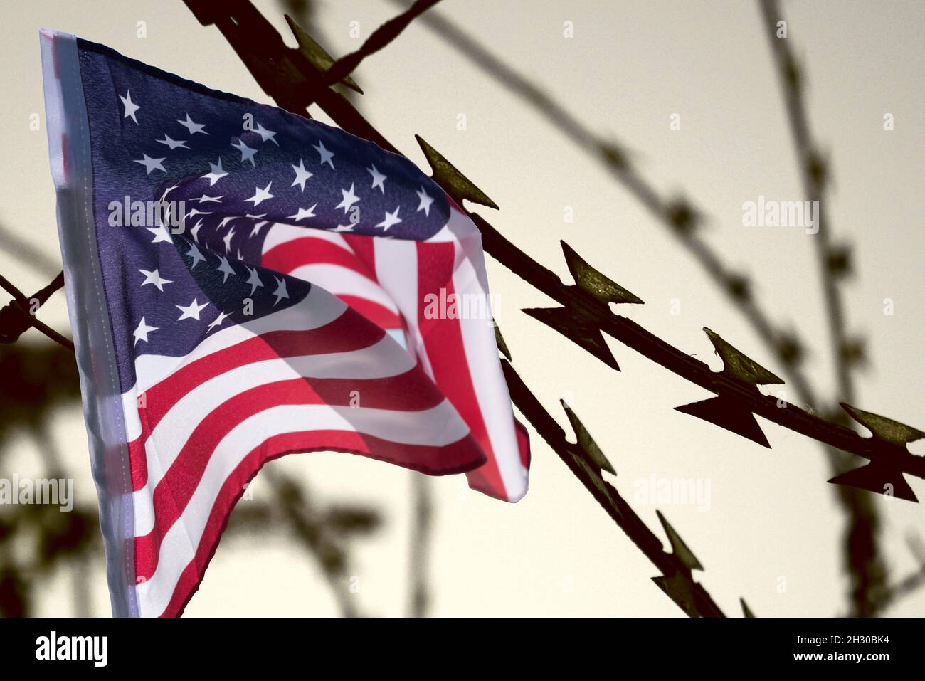 United States flag and barbed wire Stock Photo