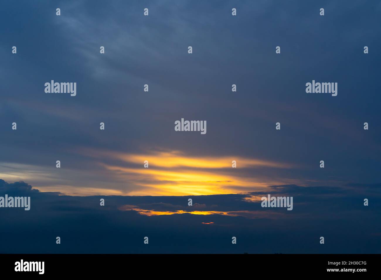 Sunset sky with dramatic clouds and beautiful dark blue cloud Stock Photo