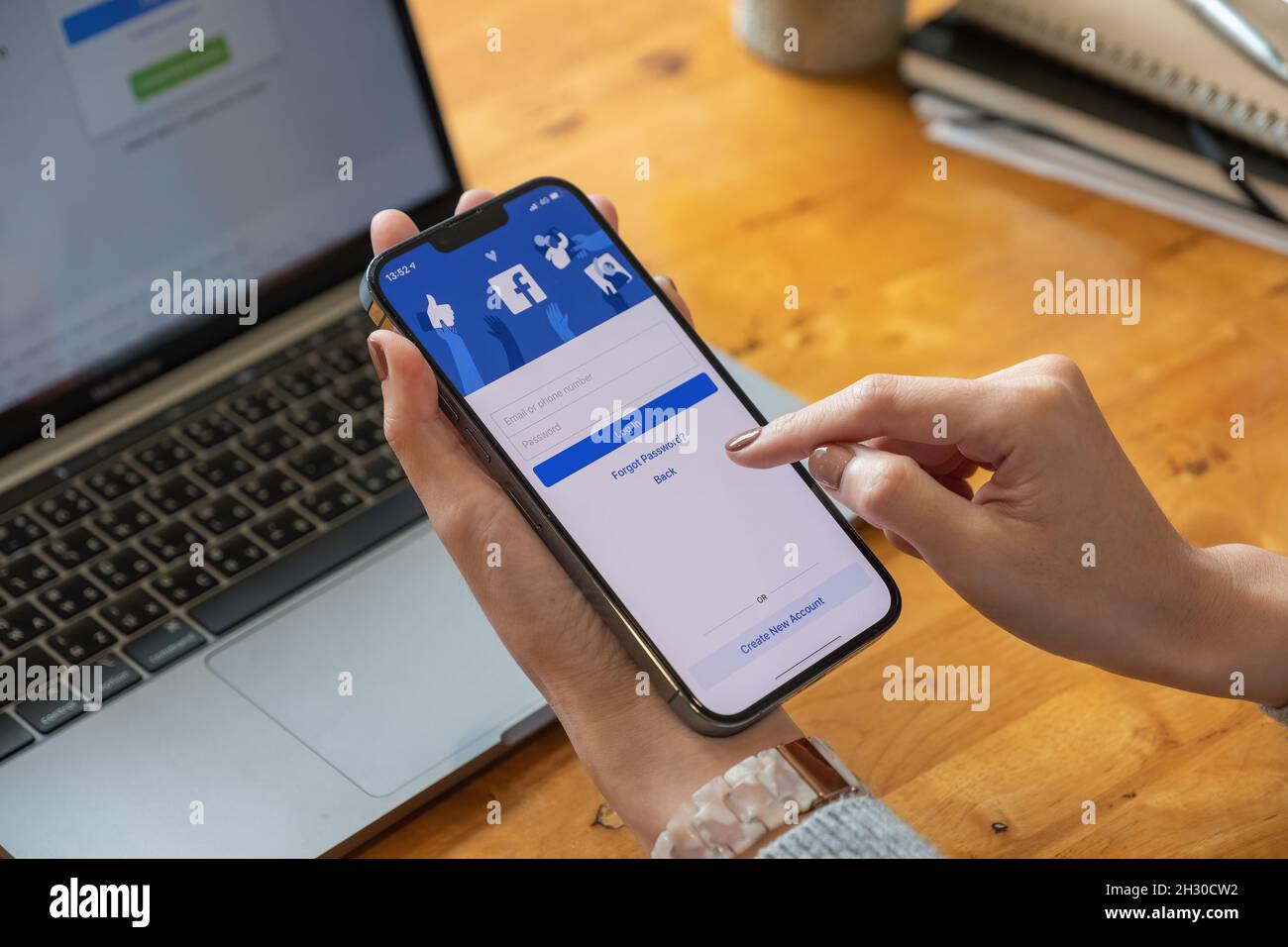 CHIANG MAI, THAILAND - OCT 17, 2021: Facebook social media app logo on log-in, sign-up registration page on mobile app screen on iPhone 13 Pro Max in Stock Photo