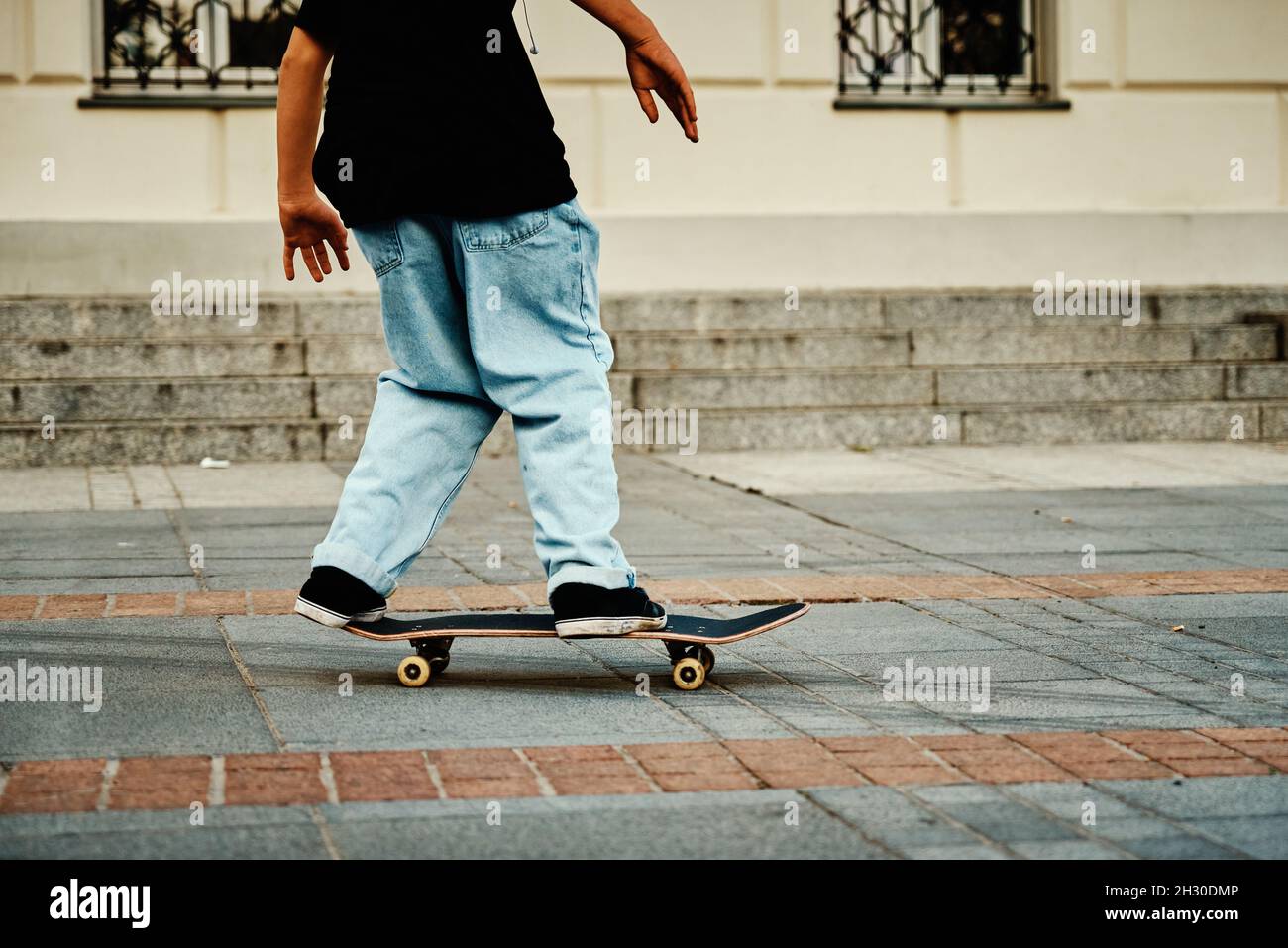 Skateboarder ride on skateboard at city street. Scater practice skate board  tricks at skatepark. Teenager extreme sport Stock Photo - Alamy