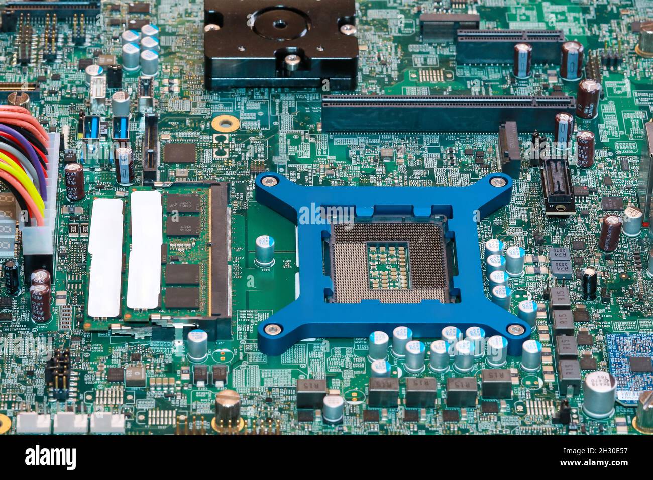 Electronic circuit board chips processor. Green PCB Component. Stock Photo