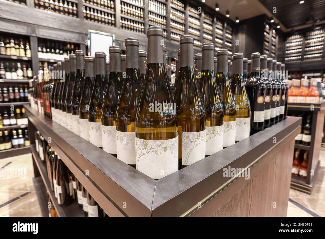 Several alcoholic beverage bottles in a liquor store. Stock Photo