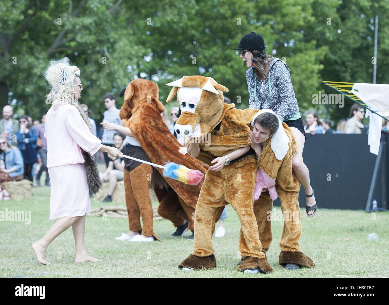 Festival goers participate in the pantomime horse race on Day 1 of