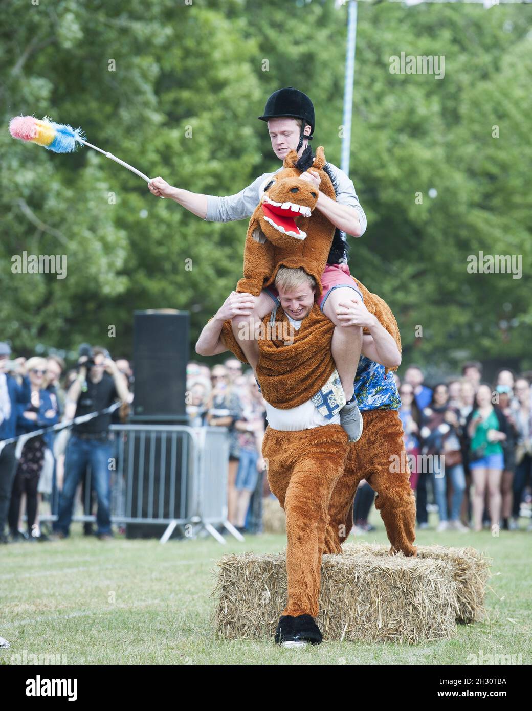 Festival goers participate in the pantomime horse race on Day 1 of