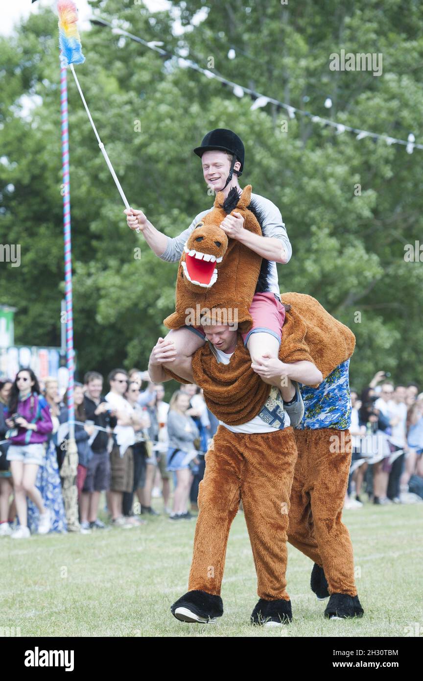 Festival goers participate in the pantomime horse race on Day 1 of
