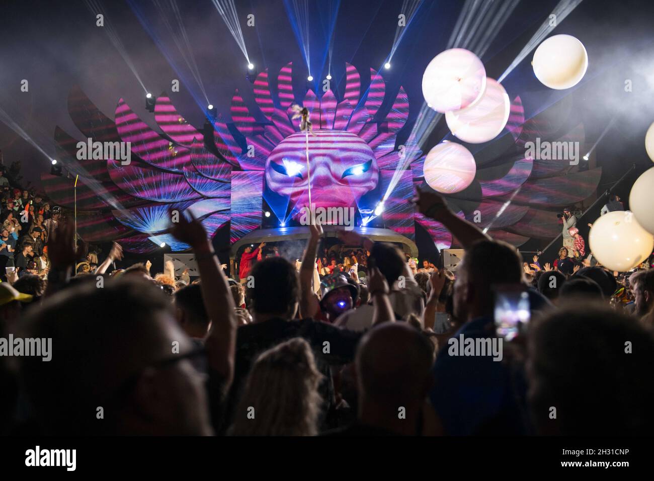 Festival goers dance inside the Temple, an all night venue in the South East corner of Glastonbury at Worthy Farm, Pilton, Somerset. Picture date: Sunday 30th June 2019.  Photo credit should read:  David Jensen/EMPICS Entertainment Stock Photo