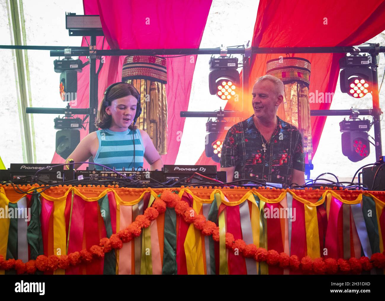 Fat Girl Slim (Nelly Cook) supported by her father Fat Boy Slim (Norman Cook) DJ's on the Bollywood stage at Camp Bestival 2021 at Lulworth Castle - Wareham. Picture date: Saturday 31st July 2021. Photo credit should read: David Jensen/EMPICS Entertainment Stock Photo