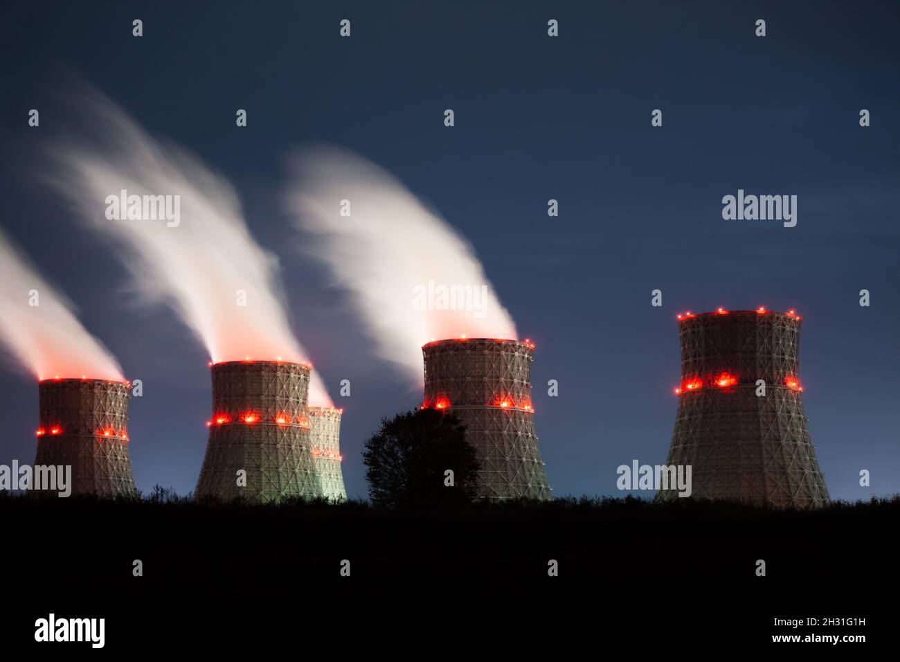 The cooling towers of the nuclear power plant at night Stock Photo - Alamy