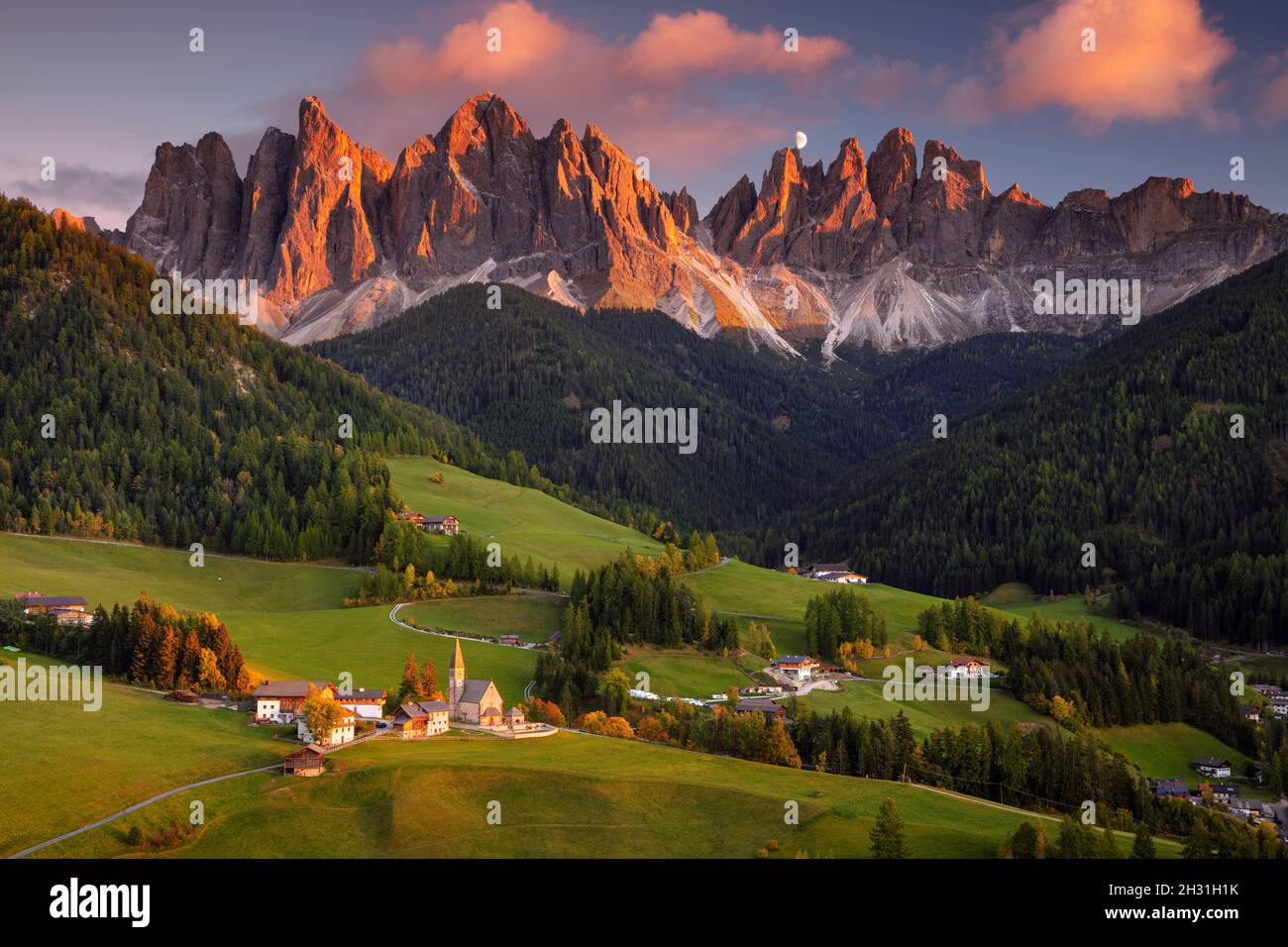 Autumn in Alps. Beautiful St. Magdalena village with magical Dolomites mountains in a gorgeous Val di Funes valley, South Tyrol, Italian Alps at autu Stock Photo