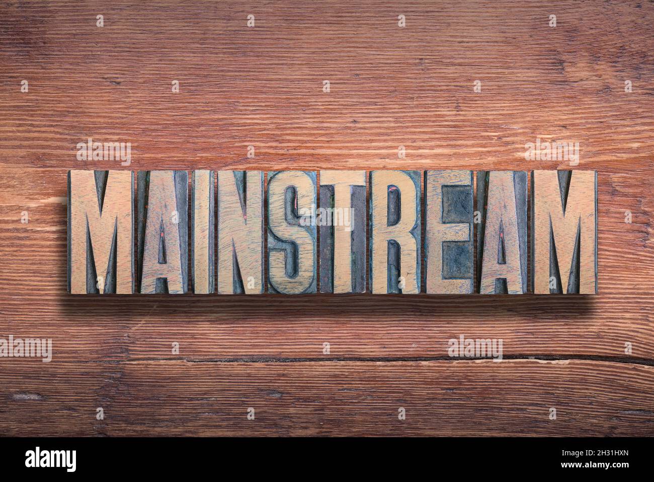 mainstream word combined on vintage varnished wooden surface Stock Photo