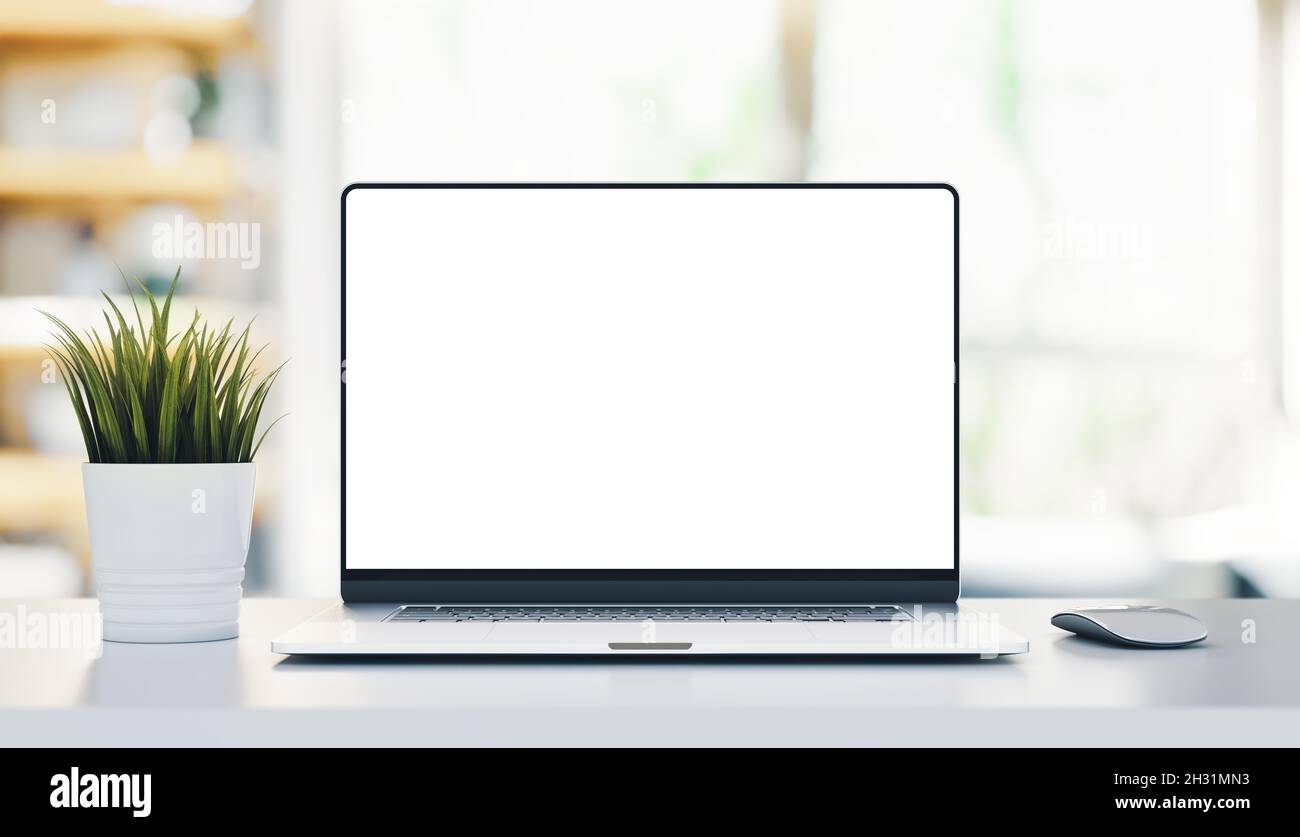Modern laptop PC with frameless blank screen on white wooden table in ...