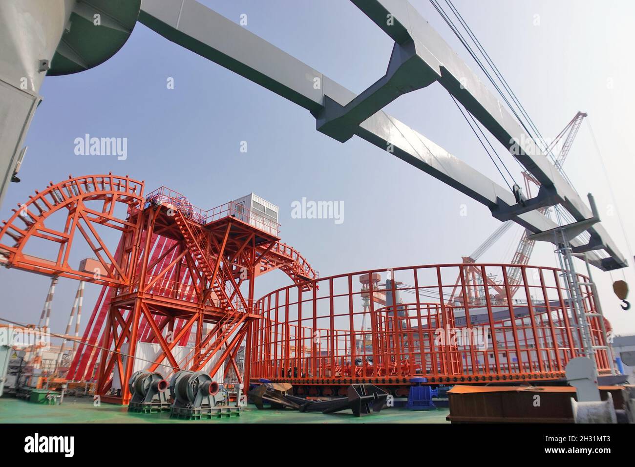 YANTAI, CHINA - OCTOBER 25, 2021 - Aerial photo taken on Oct. 25, 2021  shows cable laying equipment on runneng 168 Cable laying ship at the  construction base in Yantai, Shandong Province,