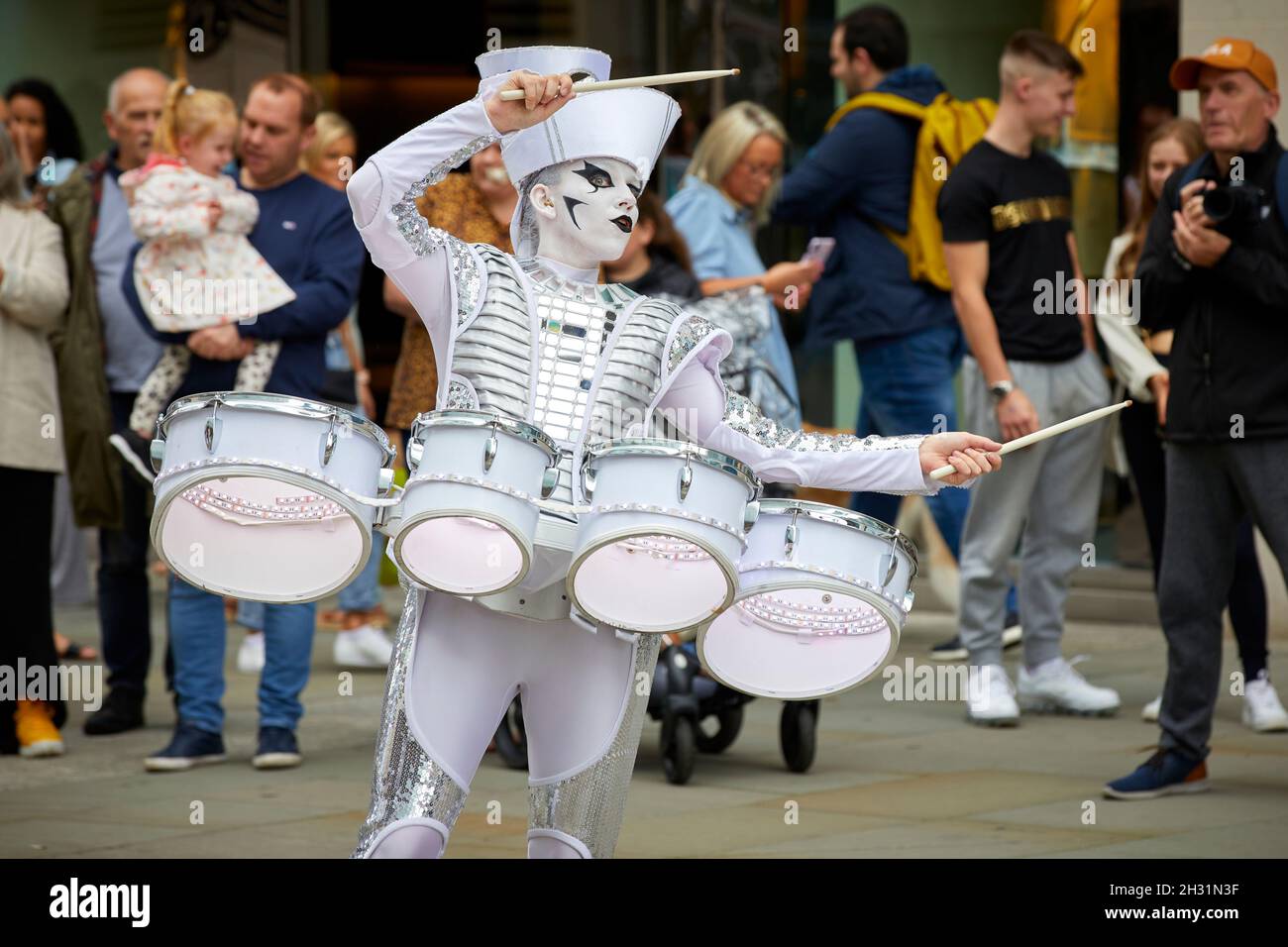 Manchester city centre Street performer playing drums Stock Photo