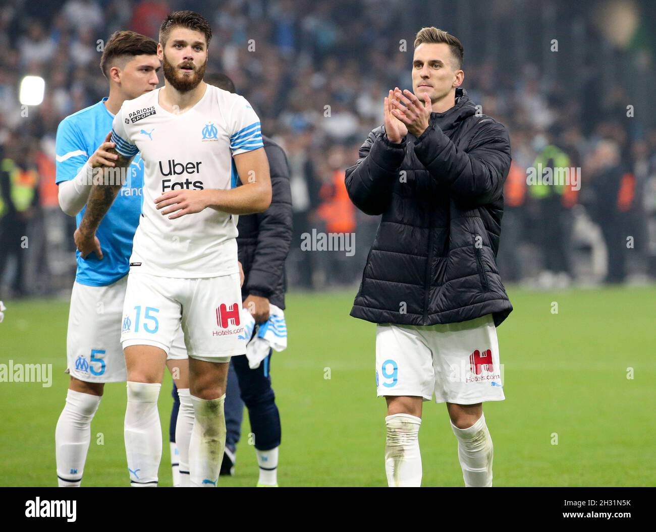 Duje Caleta-Car, Arkadiusz Milik of Marseille salute the supporters  following the French championship Ligue 1 football match between Olympique  de Marseille (OM) and Paris Saint-Germain (PSG) on October 24, 2021 at Stade
