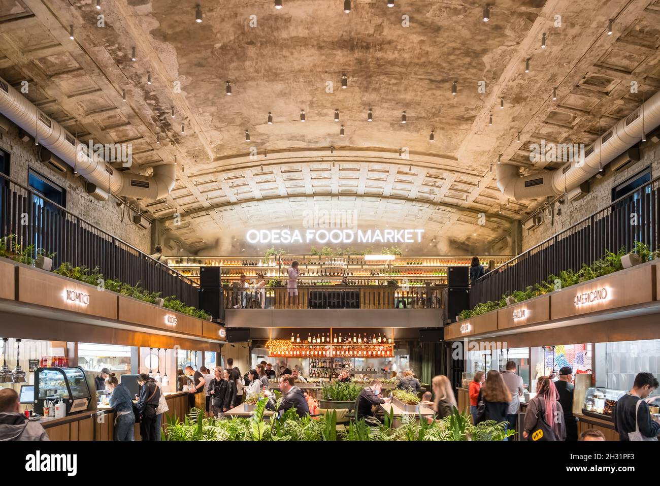 Interior of the Odessa Food Market modern urban cafe with different street food vendors in Odesa, Ukraine Stock Photo