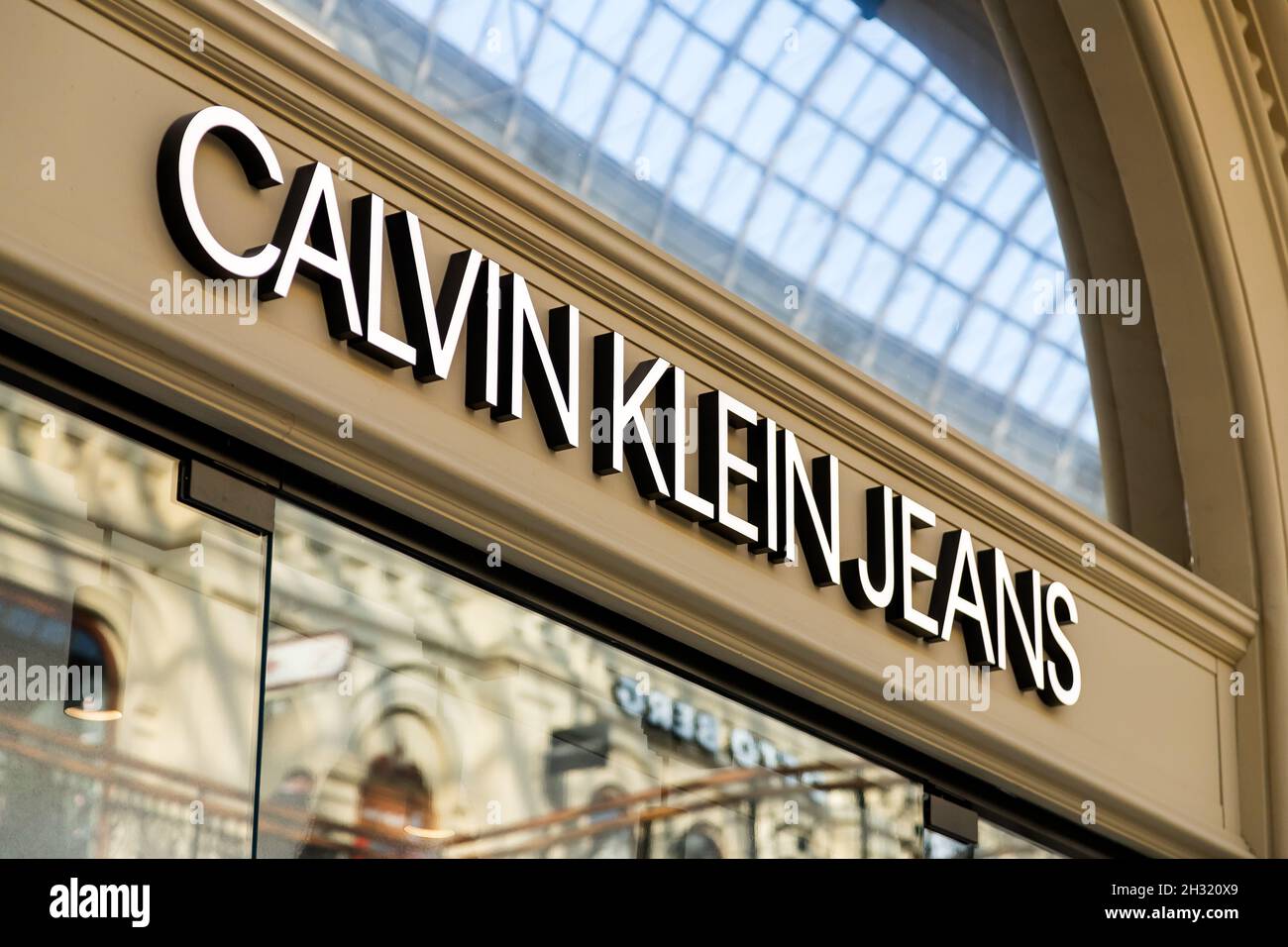 Moscow, Russia - October 14, 2021: Signboard of Calvin Klein Jeans  store. CK boutique in GUM Stock Photo
