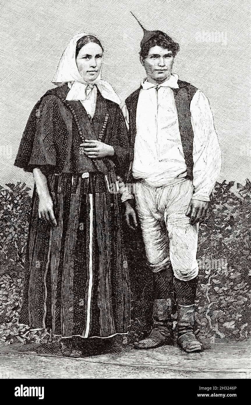 Man and woman dressed in the typical costumes, Madeira Island, Portugal. Europe. Old 19th century engraved illustration Madeira Island by Marquis Degli Albizzi from Le Tour du Monde 1889 Stock Photo