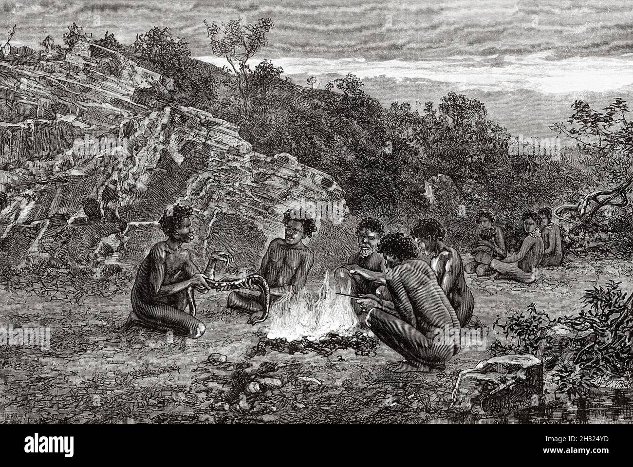 Australian aborigines preparing an eel on a bonfire. Queensland, Australia. Old 19th century engraved illustration, Journey to Northeast Australia by Carl Lumholtz 1880-1884 from Le Tour du Monde 1889 Stock Photo