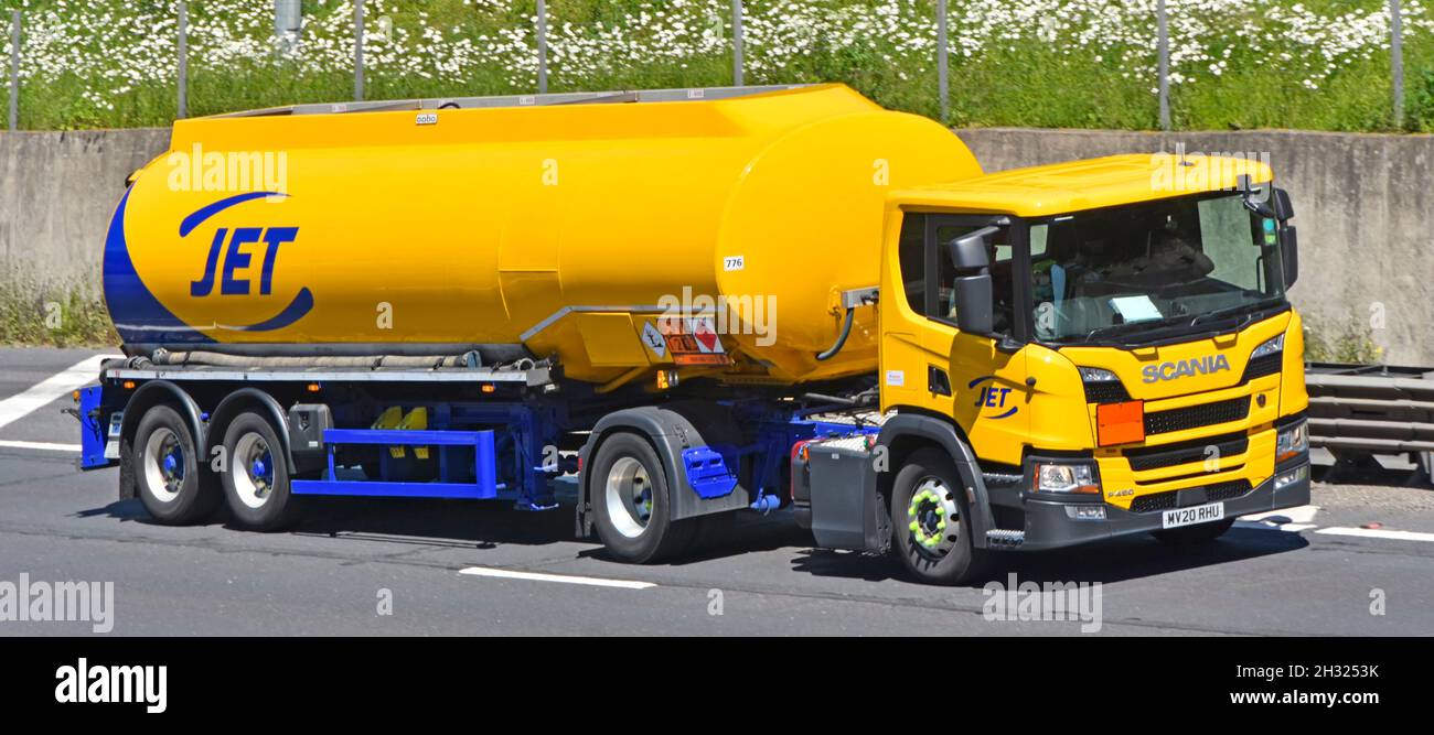 Side & front view Scania Jet lorry truck petrol filling station delivery tanker business owned by American Phillips 66 Company on UK motorway road Stock Photo