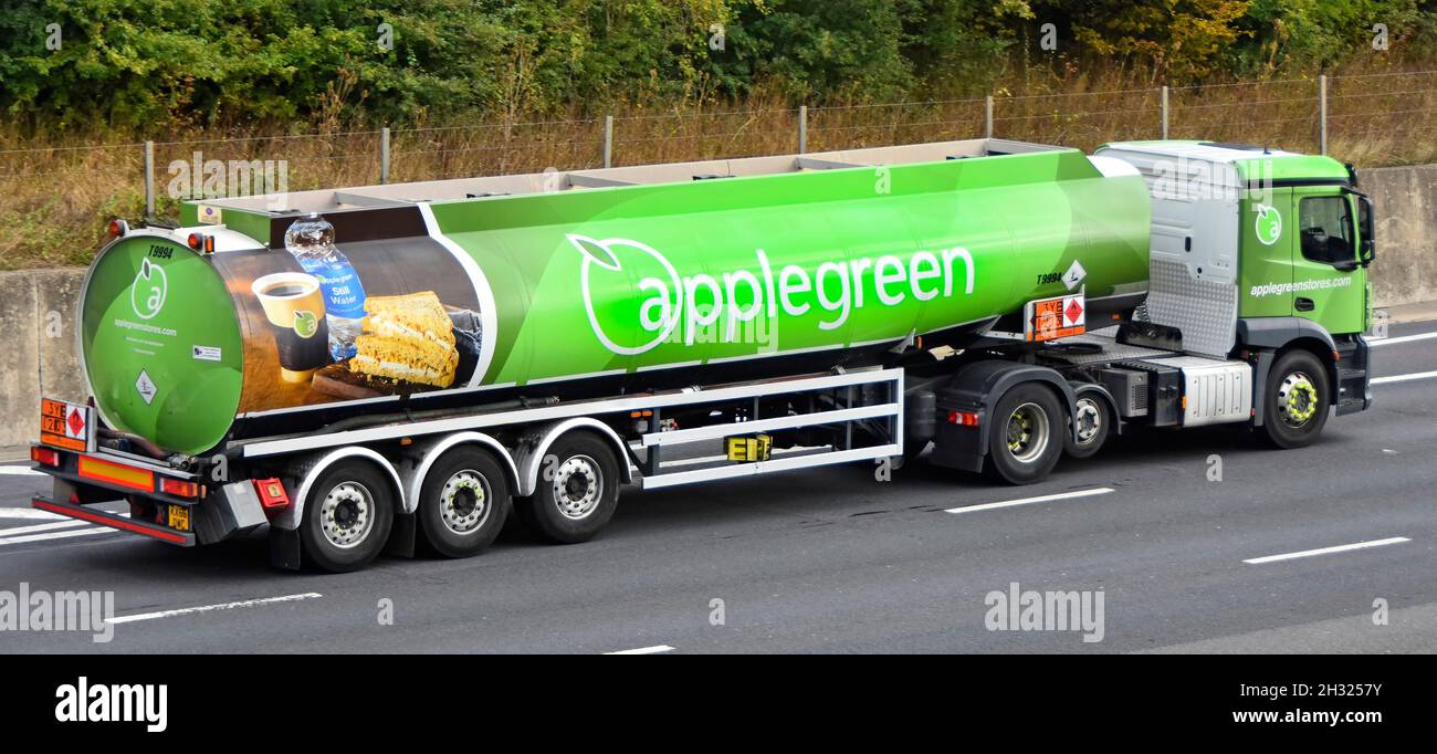 Side & back view Applegreen supply chain petrol fuel tanker filling station delivery lorry truck Hazchem warning sign on trailer driving UK motorway Stock Photo