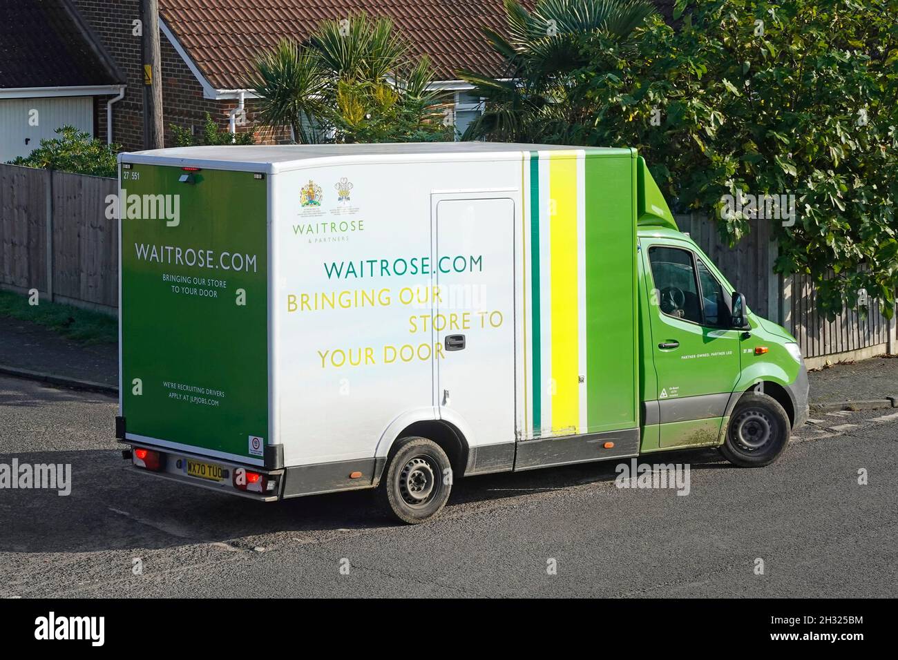 Side & back view Waitrose retail supermarket supply chain van parking  for home food grocery online shopping delivery order in UK residential road Stock Photo