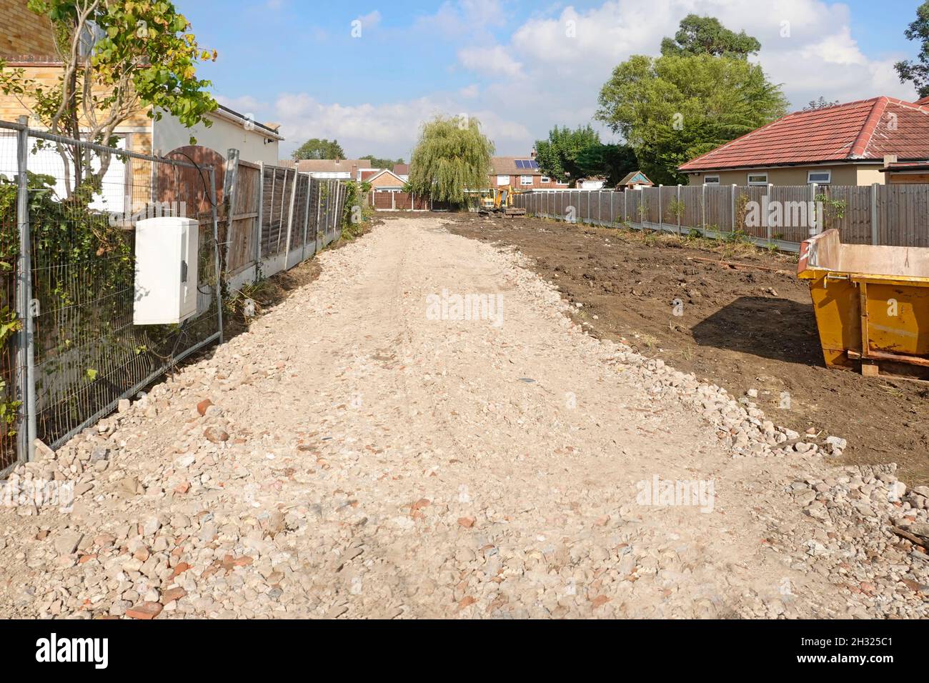 Valuable building plot of land mothballed start of coronavirus pandemic site now levelled & cleared hardcore track for trucks & foundation digging UK Stock Photo
