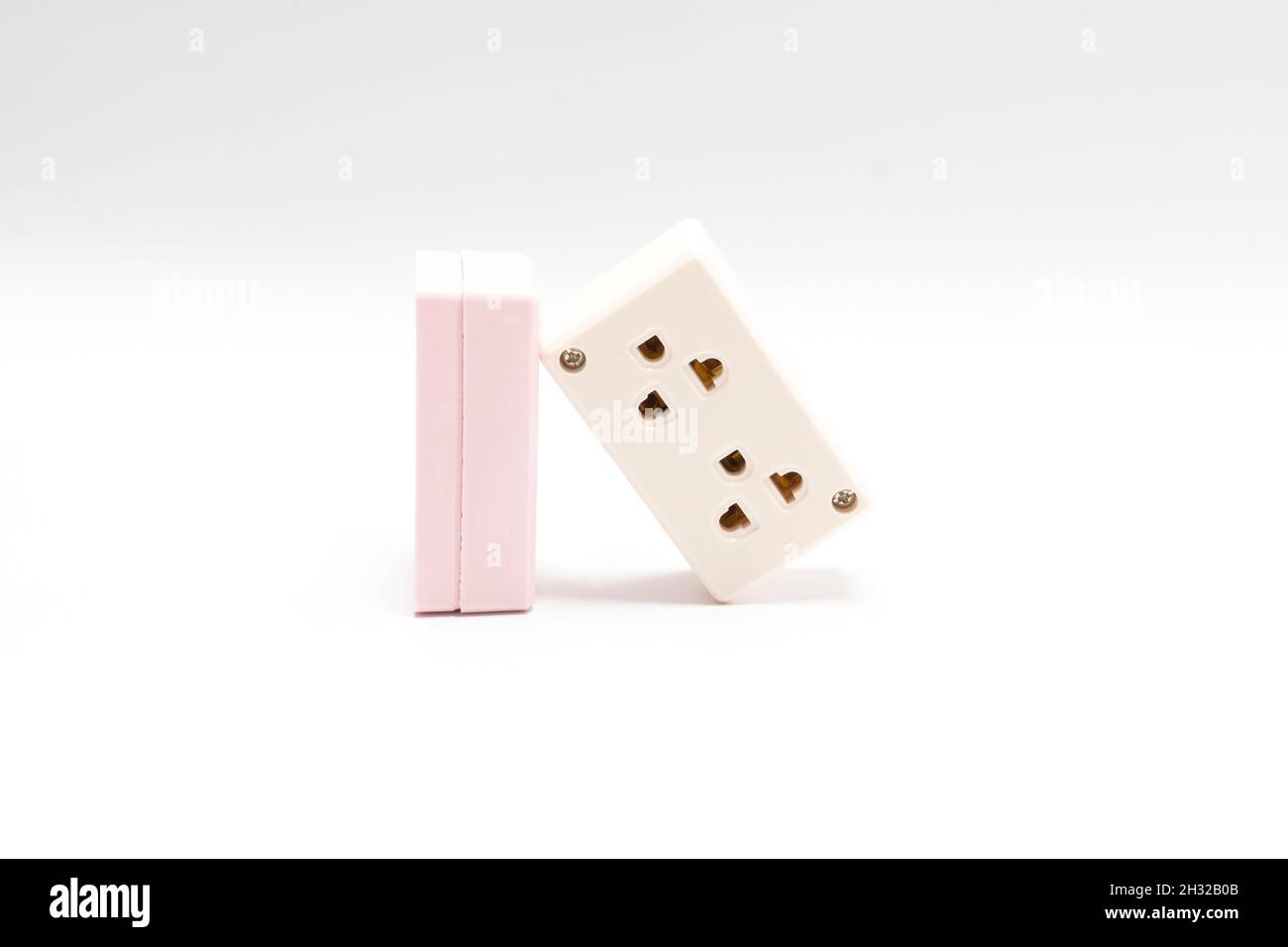 Two electrical AC power plugs and sockets, isolated on white background