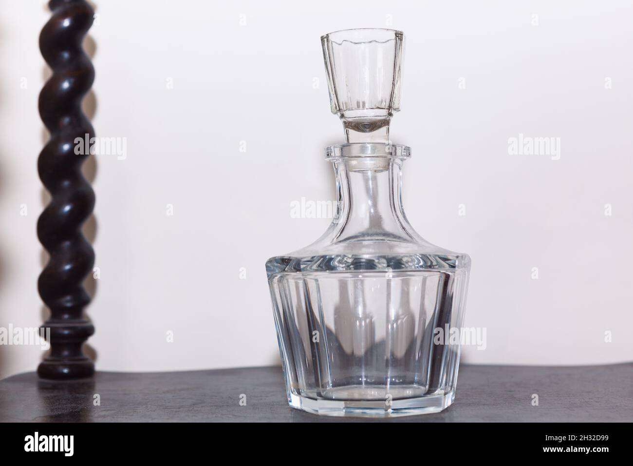 Glass decanter for vodka . Decanter with a beveled fluted stopper Stock