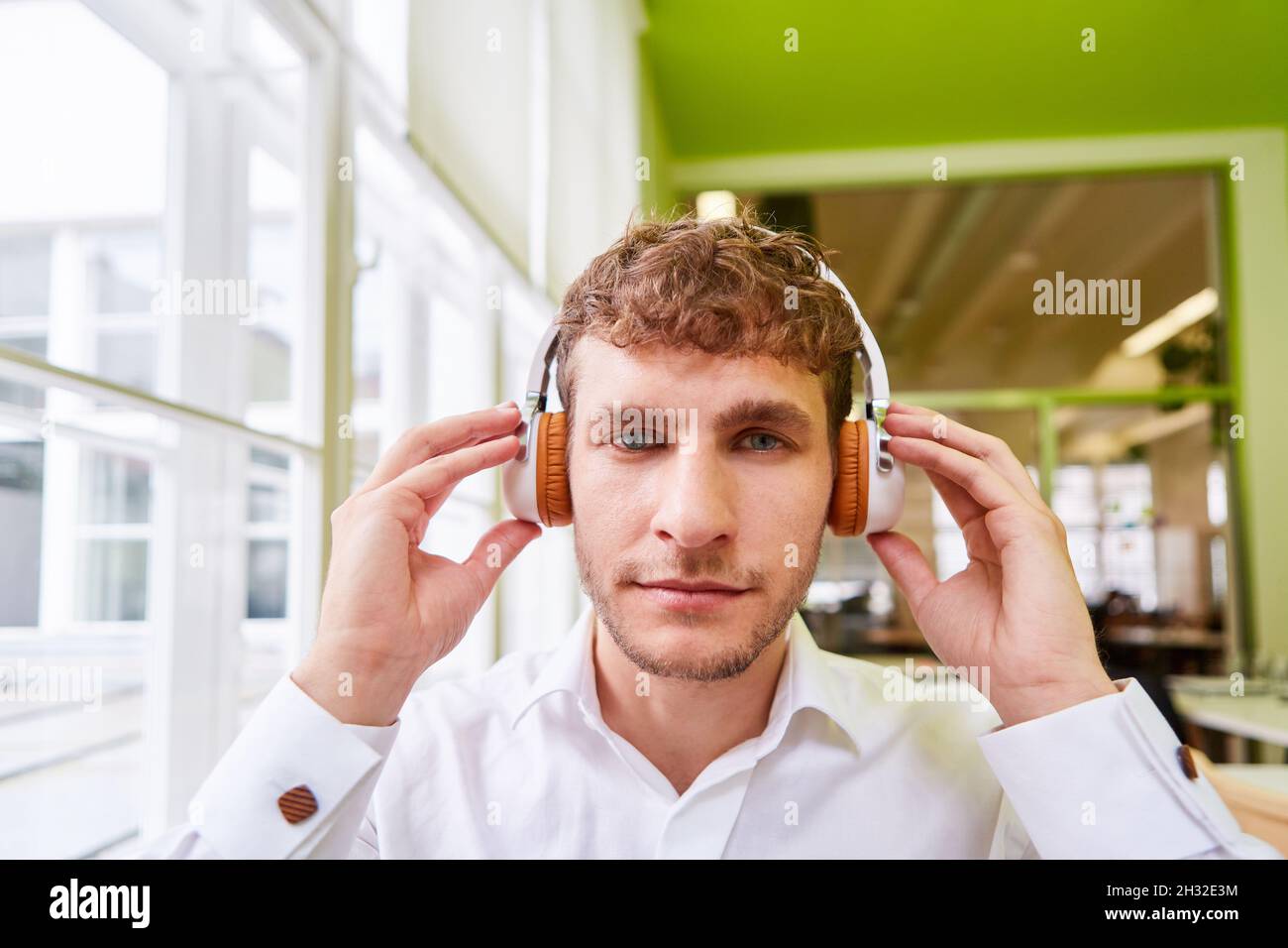 Young man as a student or businessman during e-learning or video chat ...