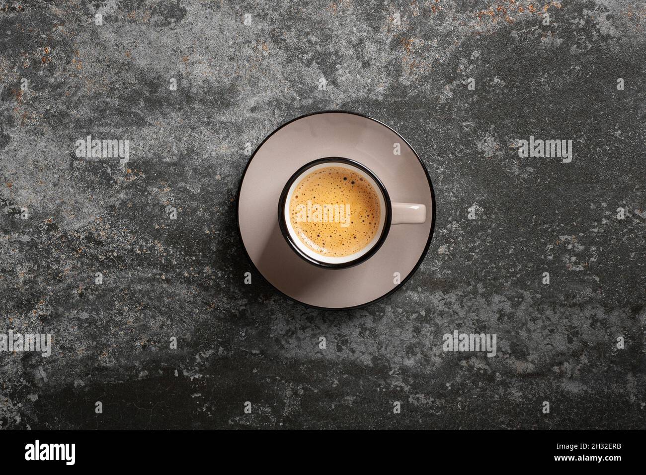 cup of coffee with beautiful foam on a concrete background top view copy space Stock Photo