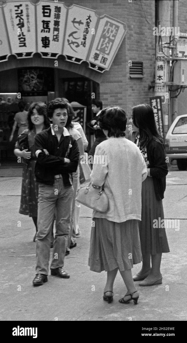 Teenagers talking on the street,Tokyo, Japan, 1979 Stock Photo