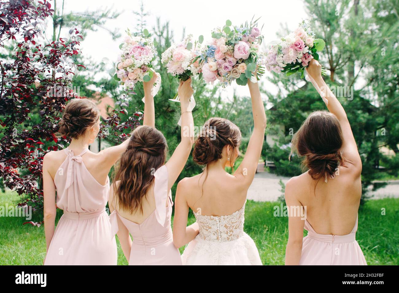 Wedding bouquets. Bridesmaid's bouquets. Bride with bridesmaids in dust
